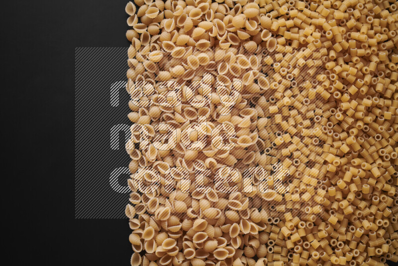 Different pasta types on black background