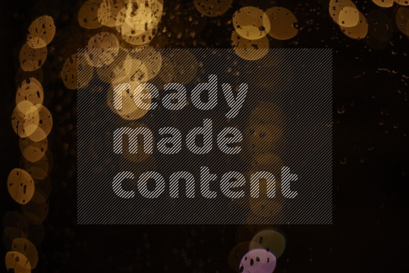 Bokeh light in yellow with water drops