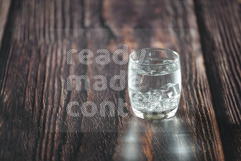 Cold drinks in a glass cup such as water, tamarind, qamar eldin, sobia, milk and hibiscus on wooden background