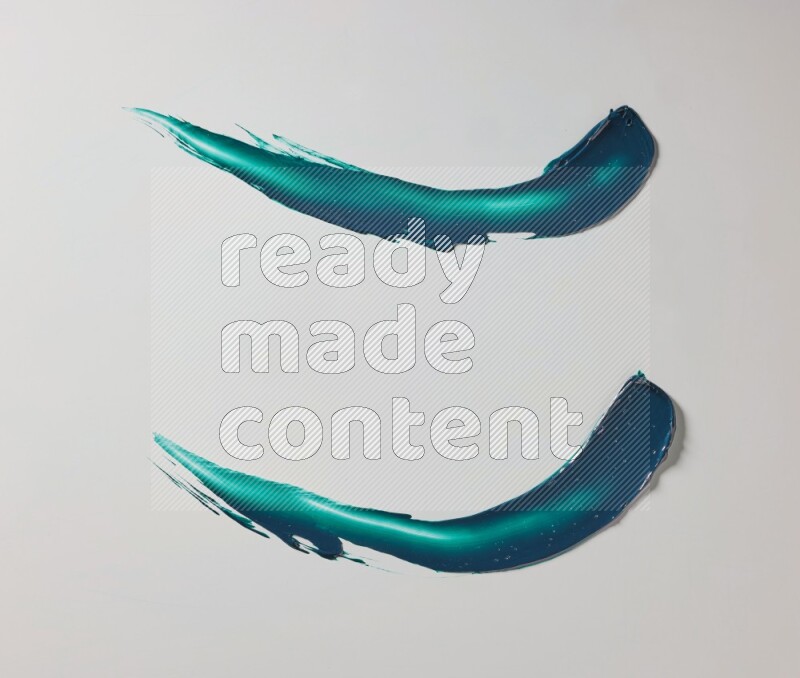 Turquoise curved painting knife strokes on white background