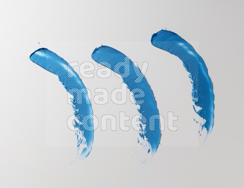 Blue painting knife strokes on white background