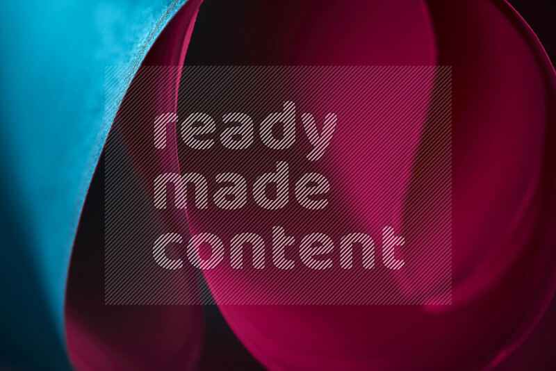 An abstract art piece displaying smooth curves in blue and red gradients created by colored light