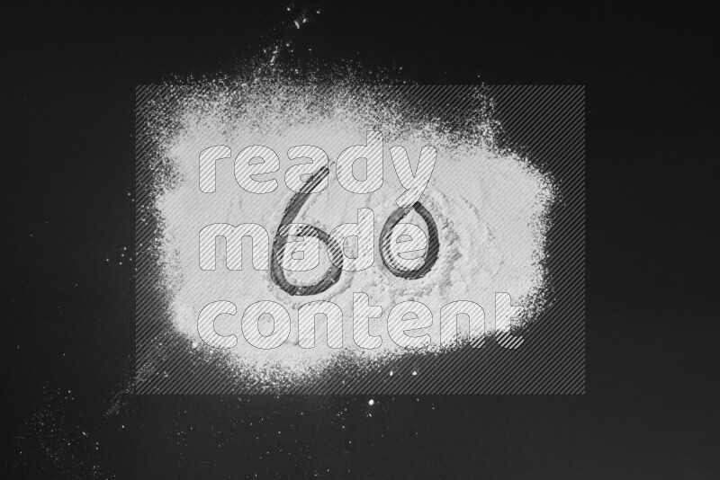 Numbers written with powder on black background