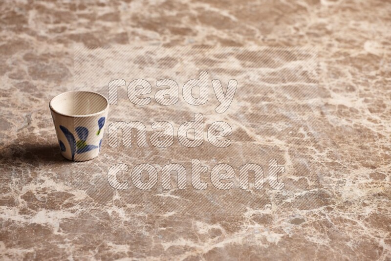 Pottery Cup on Beige Marble Flooring