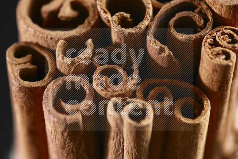 Cinnamon sticks on black background