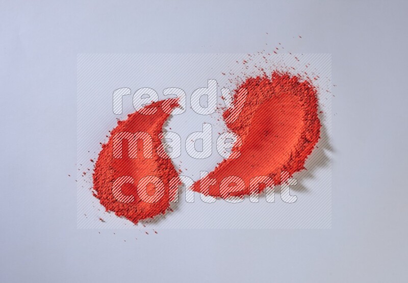 Red powder smears on white background