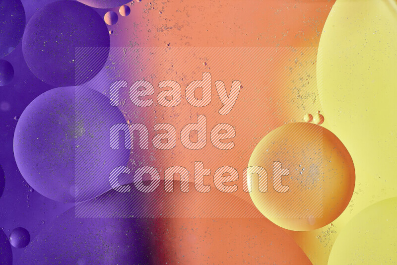 Close-ups of abstract oil bubbles on water surface in shades of yellow, orange and purple