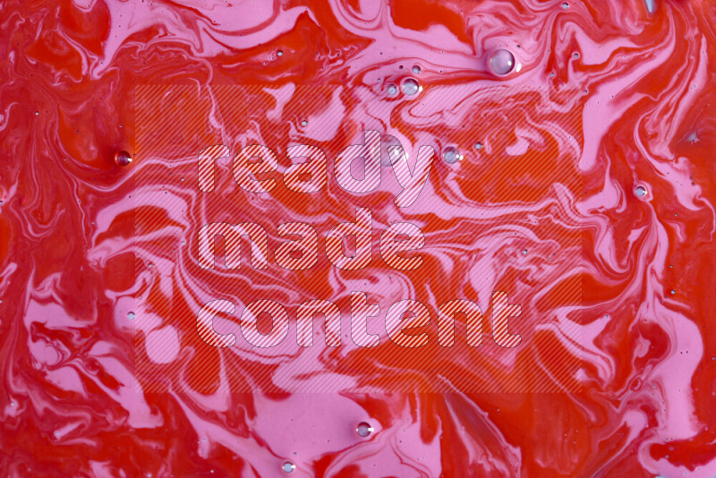 خلفية ملونة مع مزيج من ألوان الطلاء الوردي والأحمر