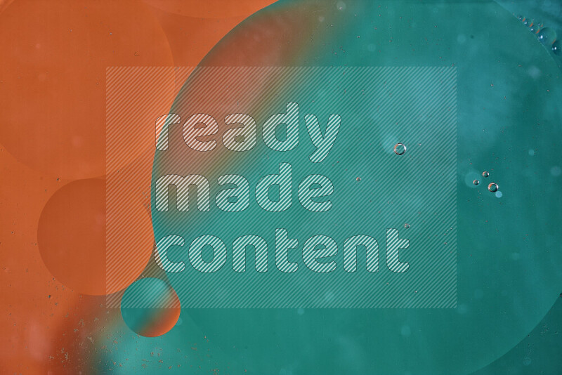 Close-ups of abstract oil bubbles on water surface in shades of green and orange