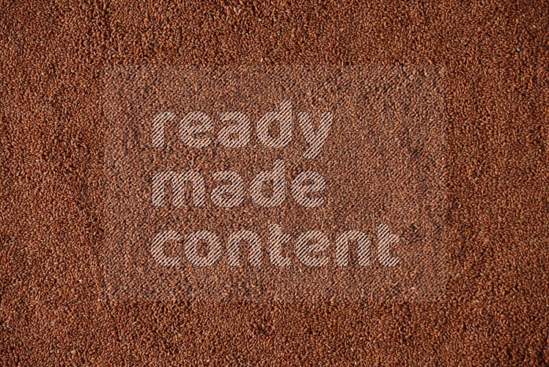 Garden cress seeds filling the frame on a black flooring