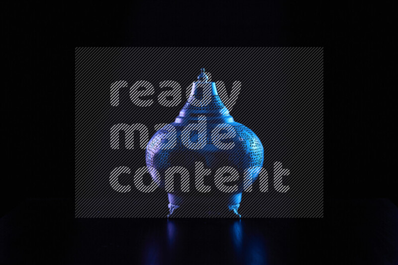 Ramadan lanterns with colored rim light against black background