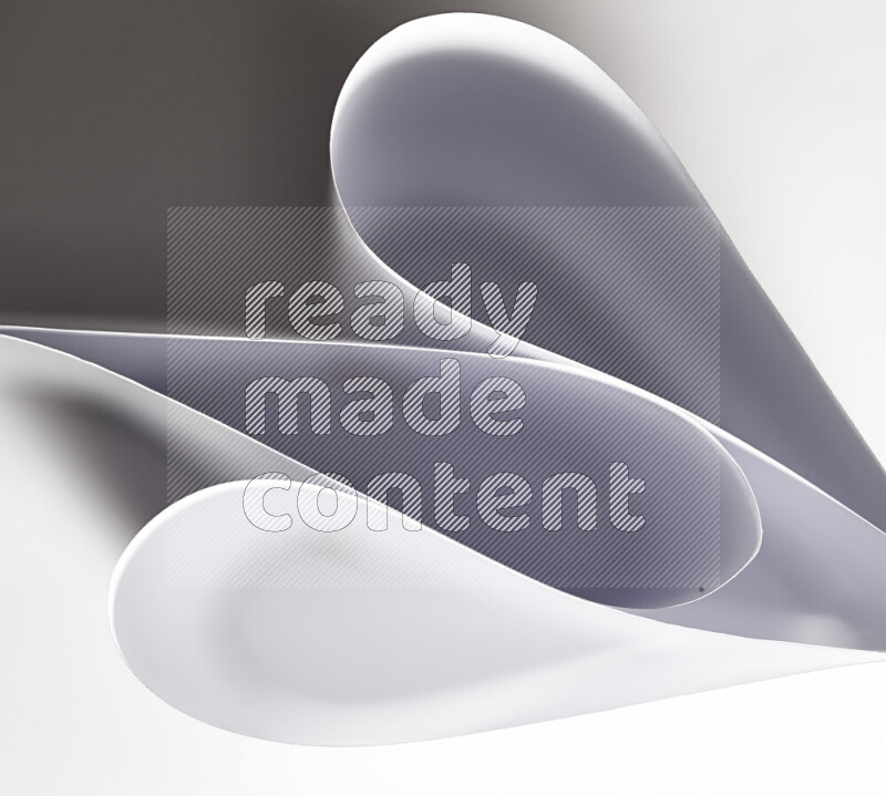 An abstract art of paper folded into smooth curves in grey gradients