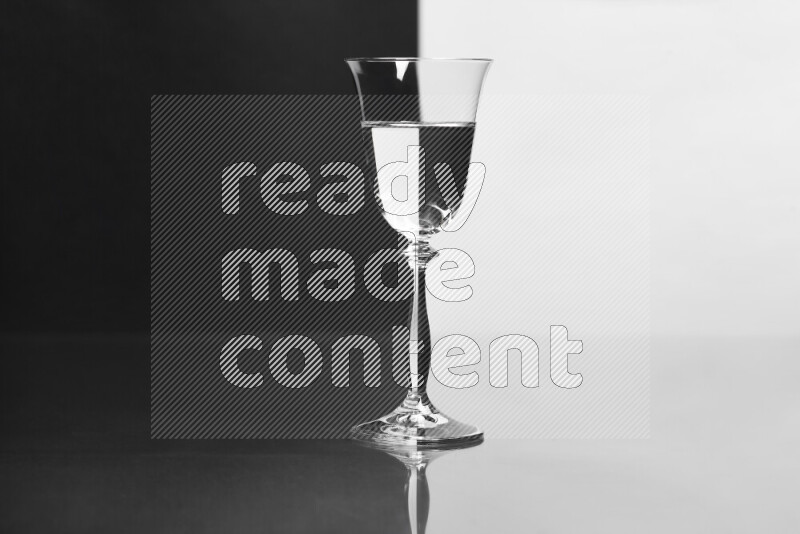 The image features a clear glassware filled with water, set against white and black background