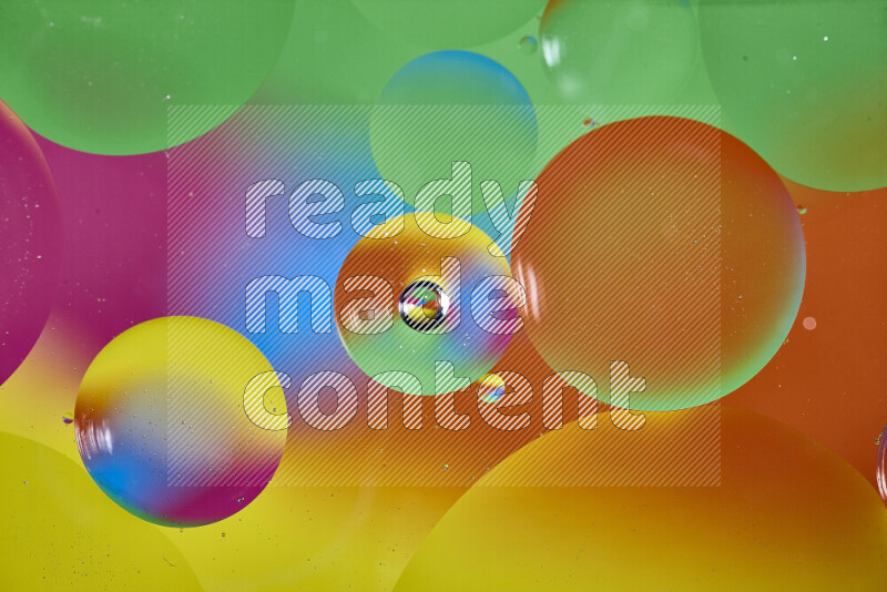 Close-ups of abstract oil bubbles on water surface in multicolors