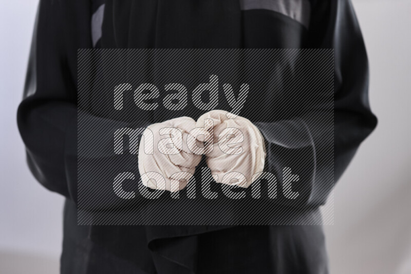 Female doctor wearing an abaya and medical attire in different positions