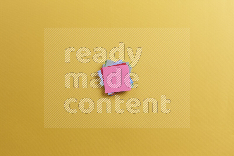 Multicolored sticky notes with school supplies on yellow background