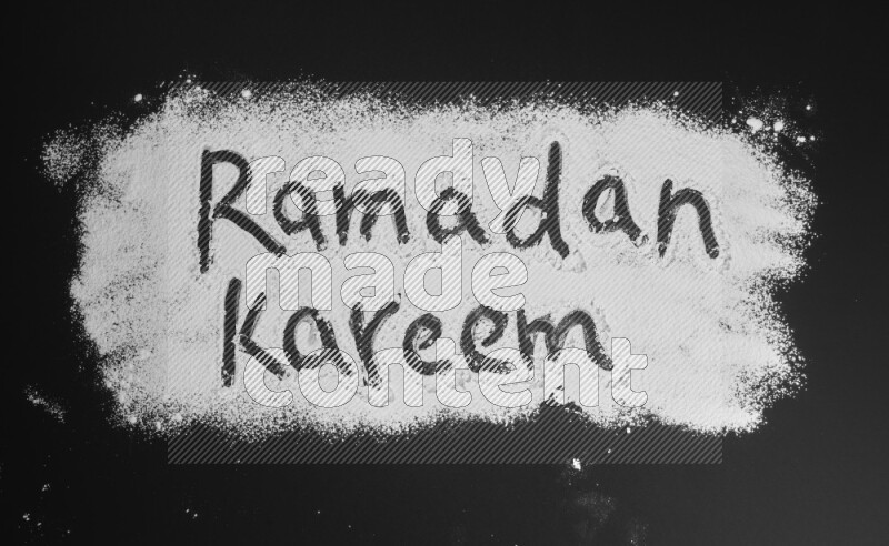 A sentence written with powder on black background