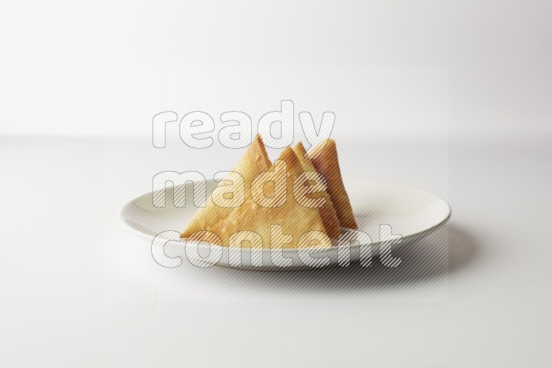 sambosas on a white background