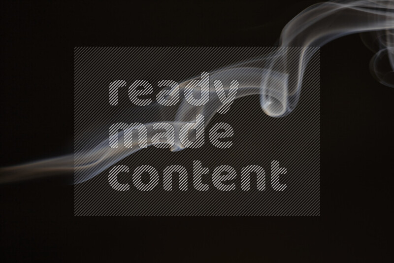 Motion of wavy smoke isolated on dark background