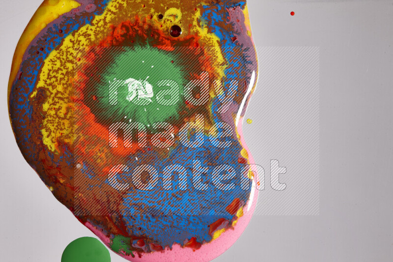 Close-ups of assorted colors blending on a grey background