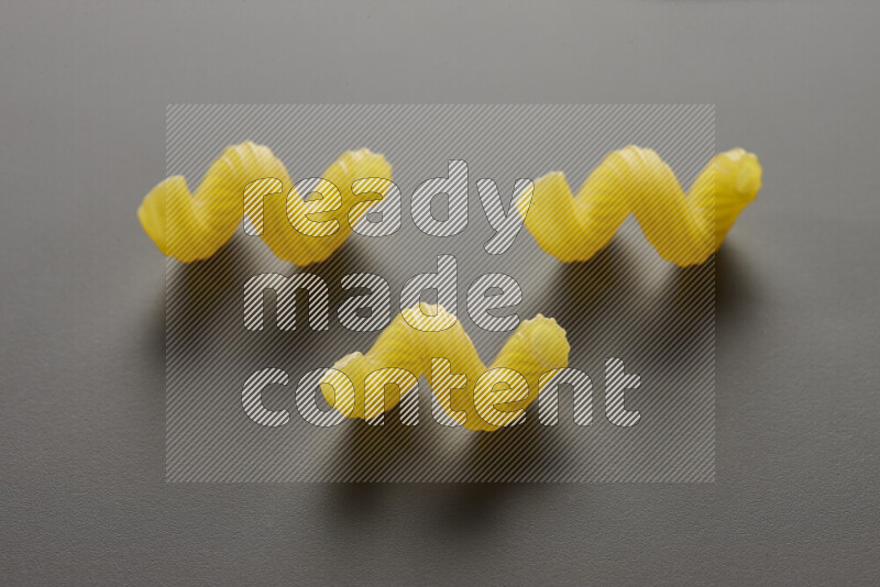 Twist pasta on grey background