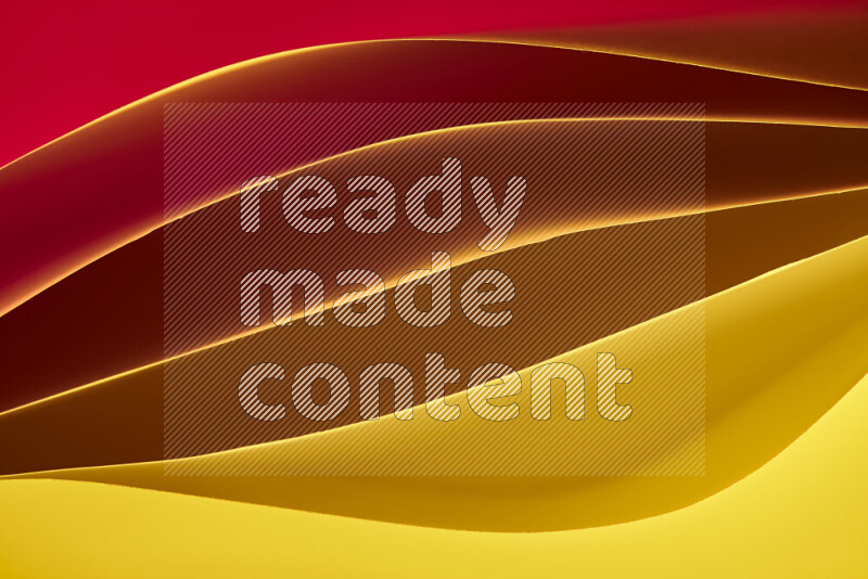 This image showcases an abstract paper art composition with paper curves in yellow, red and brown gradients created by colored light