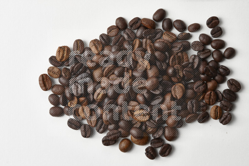 Roasted coffee beans on white background