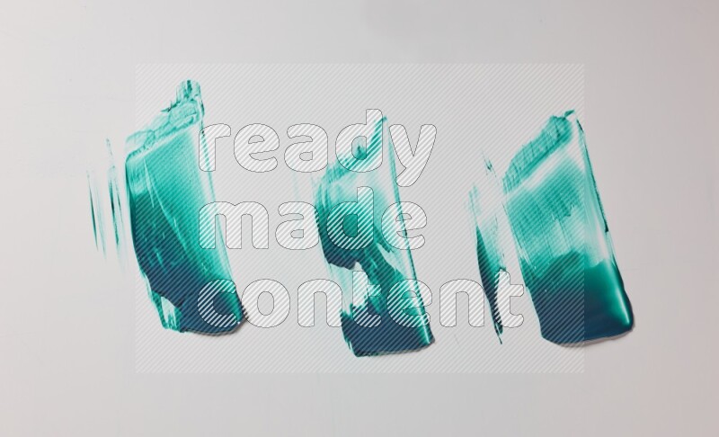Turquoise painting knife strokes on white background