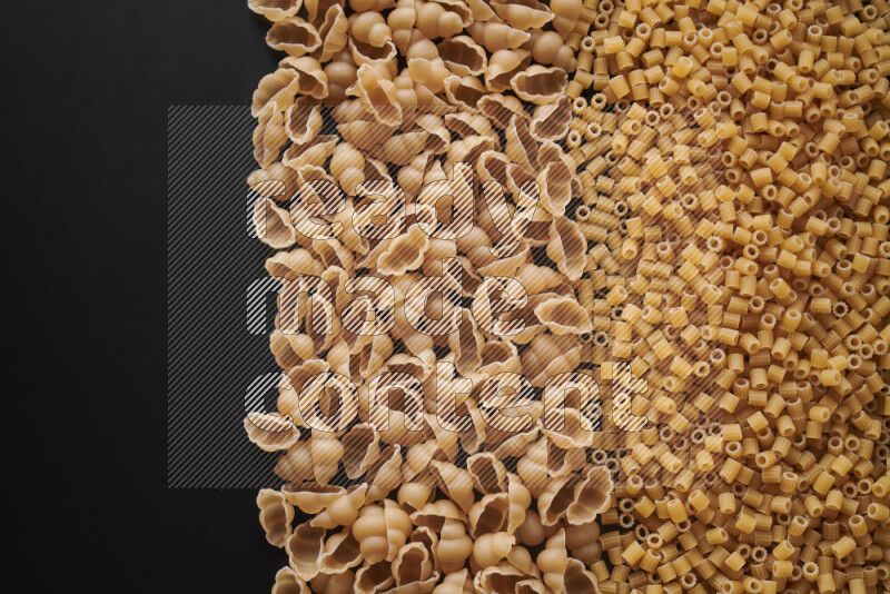 Different pasta types on black background