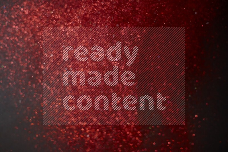 Red glitter powder isolated on black background
