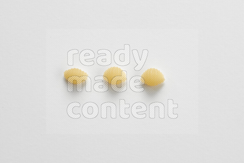 Shells pasta on white background