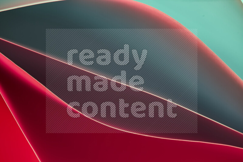 This image showcases an abstract paper art composition with paper curves in green and red gradients created by colored light