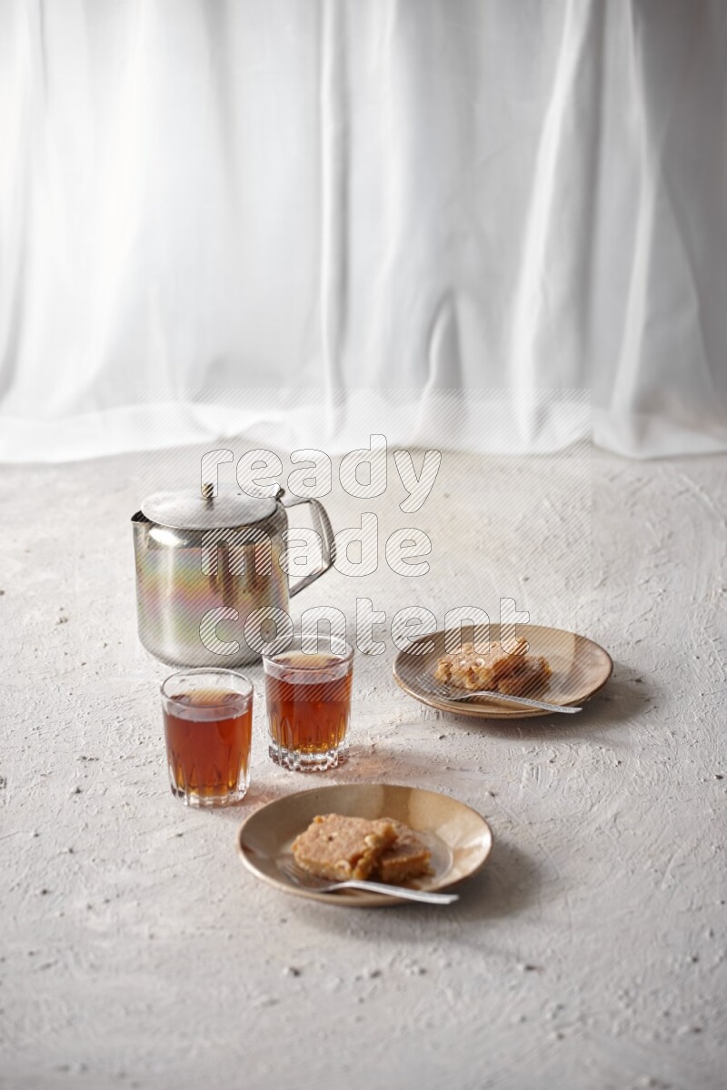 Basbousa with tea in a light setup