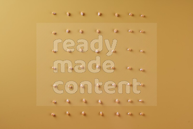 Popcorn seeds on a yellow background in different angles