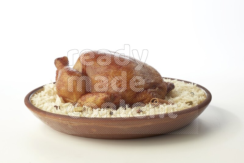 white  basmati Rice with  whole roasted chicken    on a pottery plate  direct  on white background