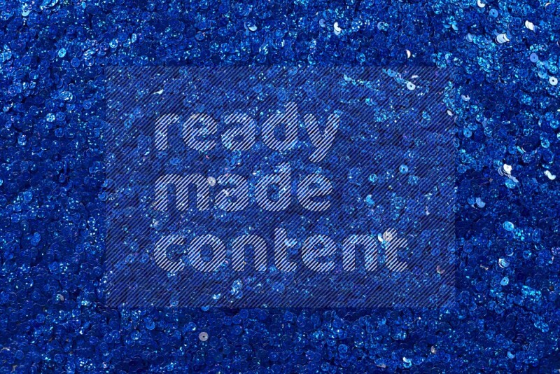 Multicolored flat sequins on grey background