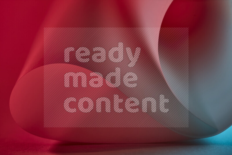 An abstract art piece displaying smooth curves in blue and red gradients created by colored light