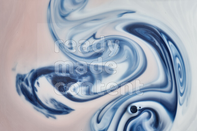 A close-up of abstract swirling patterns in blue, red and white