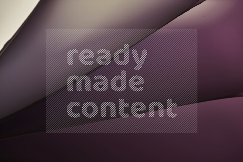 An abstract art piece displaying smooth curves in warm and cold gradients created by colored light