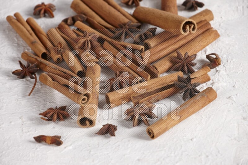 cinnamon sticks with star anise on white background