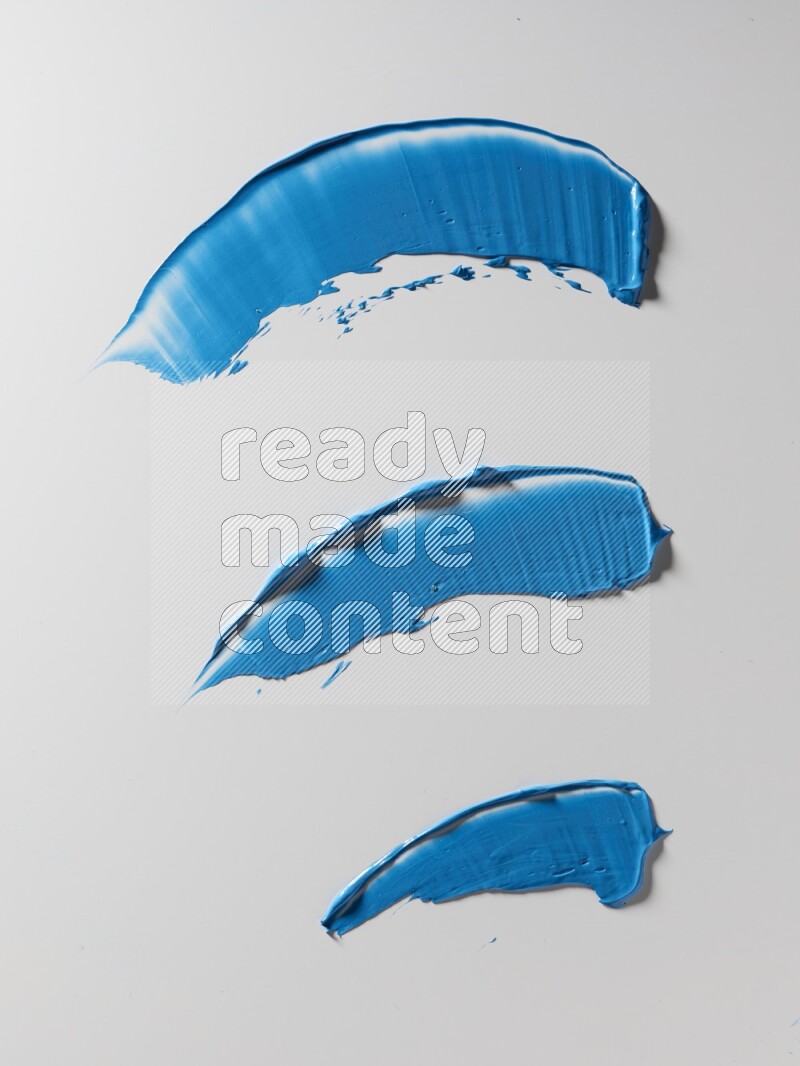 Blue painting knife strokes on white background