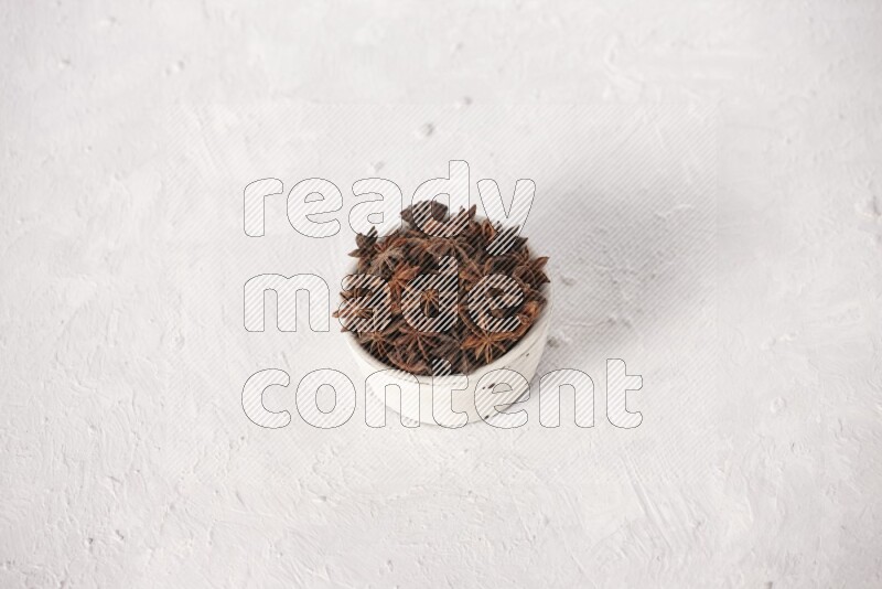 Star Anise in a white bowl on white background