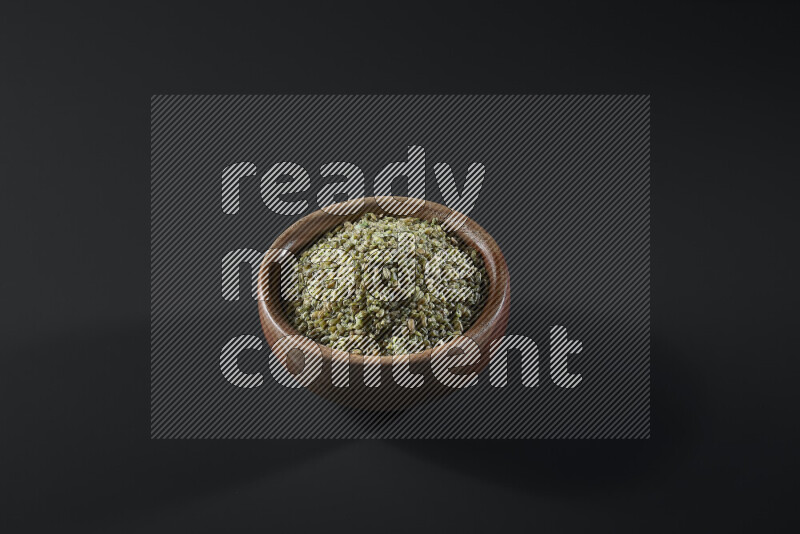 Freekeh in a wooden bowl on grey background
