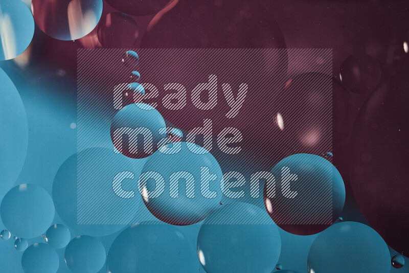 Close-ups of abstract oil bubbles on water surface in shades of blue and purple