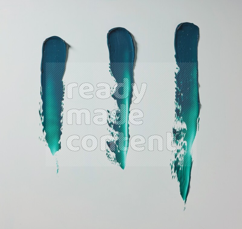 Turquoise painting knife strokes on white background