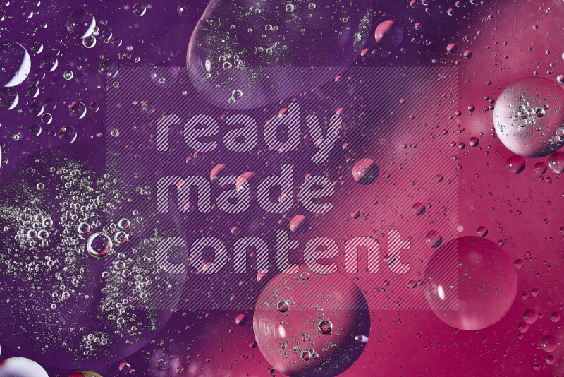 Close-ups of abstract oil bubbles on water surface in shades of purple and pink