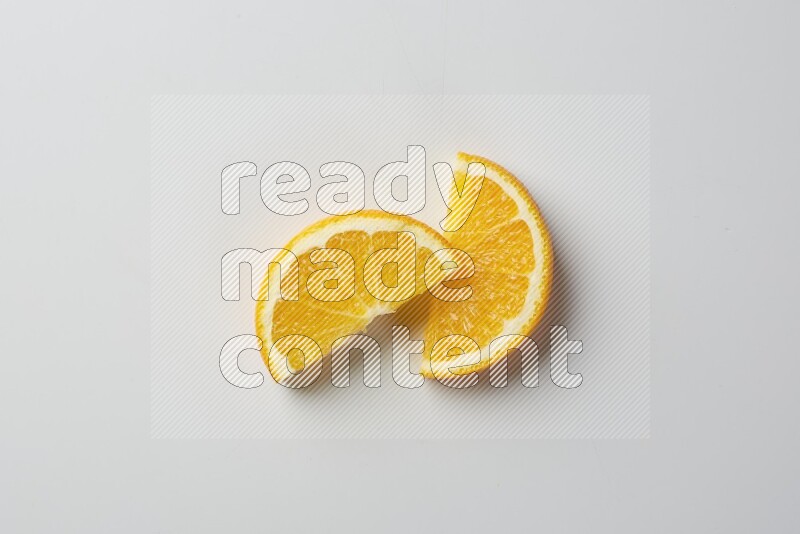 Two halves of an orange slices on white background