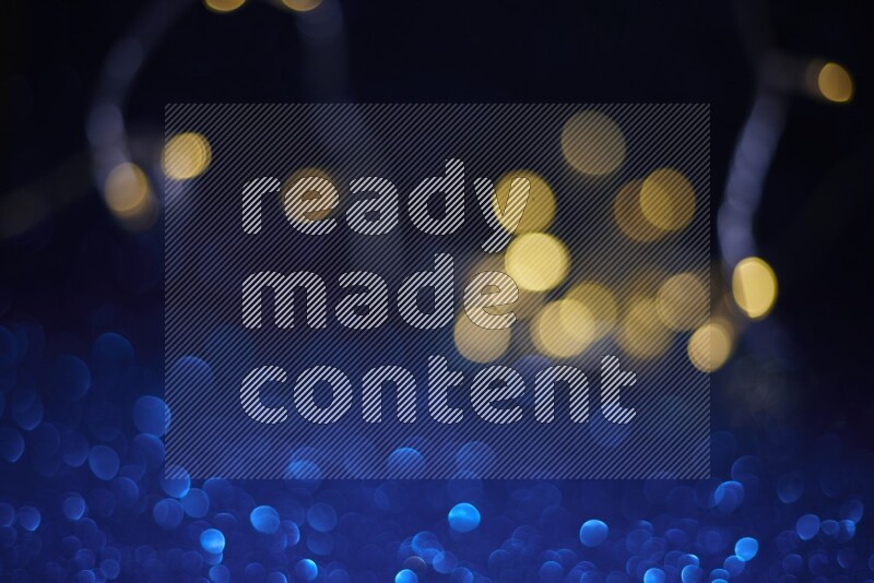 Bokeh light in yellow with blue background