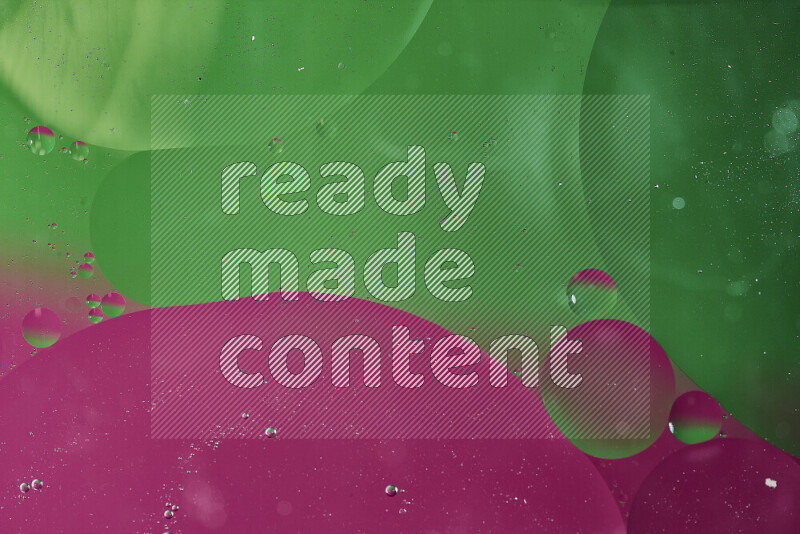 Close-ups of abstract oil bubbles on water surface in shades of green and pink