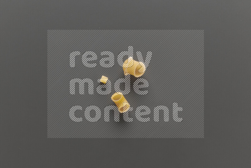 Different pasta types on grey background